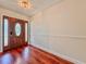 Foyer featuring beautiful wood floors and a decorative front door with sidelights at 1742 Willa Cir, Winter Park, FL 32792