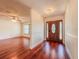 Elegant foyer with gleaming wood floors and a decorative front door at 1742 Willa Cir, Winter Park, FL 32792