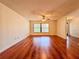 Spacious living room featuring gleaming hardwood floors and a large window for natural light at 1742 Willa Cir, Winter Park, FL 32792