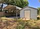 Backyard shed providing additional storage, as well as a metal carport at 1742 Willa Cir, Winter Park, FL 32792