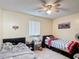 Functional bedroom with tile flooring, ceiling fan, and natural light at 1748 Foxhall Cir # 1748, Kissimmee, FL 34741