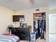 Bedroom featuring tile flooring, fan, and a closet for storage at 1748 Foxhall Cir # 1748, Kissimmee, FL 34741