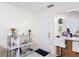 Open kitchen area featuring barstool seating, decor and bar area with a front door in view at 1748 Foxhall Cir # 1748, Kissimmee, FL 34741