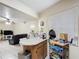 Bright living and kitchen area with tile floors, bar stool area and cozy furniture at 1748 Foxhall Cir # 1748, Kissimmee, FL 34741