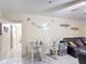 Inviting living room featuring tile floors and a glass top dining table at 1748 Foxhall Cir # 1748, Kissimmee, FL 34741