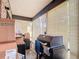 Enclosed patio with a grill and boxes provides an outdoor cooking and storage solution, enhancing functionality at 1748 Foxhall Cir # 1748, Kissimmee, FL 34741