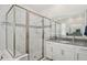 Modern bathroom features a large glass shower, stylish tile, and vanity at 1835 Southern Red Oak Ct, Ocoee, FL 34761