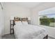 Cozy bedroom with natural light, stylish headboard, and comfortable decor at 1835 Southern Red Oak Ct, Ocoee, FL 34761