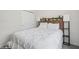 Inviting bedroom featuring a comfortable bed with a decorative wooden headboard at 1835 Southern Red Oak Ct, Ocoee, FL 34761