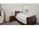 Charming bedroom features a wood frame bed, and side table at 1835 Southern Red Oak Ct, Ocoee, FL 34761