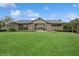 Community entrance with a gate, showcasing lush landscaping and a welcoming design at 1835 Southern Red Oak Ct, Ocoee, FL 34761