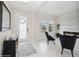 Bright entryway with white tile flooring, fireplace and stylish black armchairs at 1835 Southern Red Oak Ct, Ocoee, FL 34761