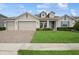 Charming one-story home featuring a three-car garage and well-manicured front lawn at 1835 Southern Red Oak Ct, Ocoee, FL 34761