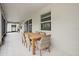 Covered patio showcases a dining set, offering a comfortable outdoor dining space at 1835 Southern Red Oak Ct, Ocoee, FL 34761