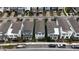 Aerial view of a row of charming single-Gathering homes with well-manicured lawns and driveways at 1997 Standing Rock Cir, Oakland, FL 34787