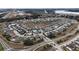 An aerial view showcasing a neighborhood with a pool and common areas at 1997 Standing Rock Cir, Oakland, FL 34787