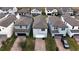 Picture of the rear of a two-story house with a brick driveway and attached garage at 1997 Standing Rock Cir, Oakland, FL 34787