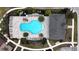 Aerial view of a sparkling community pool with lounge chairs and nearby building at 1997 Standing Rock Cir, Oakland, FL 34787