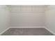 Walk-in closet with carpet and wire shelving at 1997 Standing Rock Cir, Oakland, FL 34787