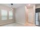 Bright dining area with tile flooring, modern pendant lighting, and natural light from large windows at 1997 Standing Rock Cir, Oakland, FL 34787