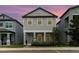 Charming two-story home featuring a symmetrical design and manicured front yard, offering an inviting curb appeal at 1997 Standing Rock Cir, Oakland, FL 34787