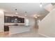 Well-lit kitchen featuring an island, pendant lighting, and modern appliances, perfect for cooking and entertaining at 1997 Standing Rock Cir, Oakland, FL 34787