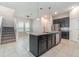 Contemporary kitchen with a central island, stainless steel appliances, and easy access to the staircase at 1997 Standing Rock Cir, Oakland, FL 34787