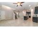 Open-concept living space with kitchen island, stainless steel appliances, tile flooring and lots of natural light at 1997 Standing Rock Cir, Oakland, FL 34787