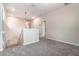 Carpeted loft area with staircase and hallway at 1997 Standing Rock Cir, Oakland, FL 34787