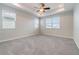 Large main bedroom with recessed ceiling, ceiling fan, carpet and lots of natural light at 1997 Standing Rock Cir, Oakland, FL 34787