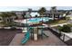 A community playground, surrounded by a black fence and lush landscaping at 1997 Standing Rock Cir, Oakland, FL 34787