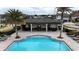 A beautiful community pool with clear water and a covered seating area at 1997 Standing Rock Cir, Oakland, FL 34787