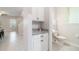 The powder room features granite countertops and updated fixtures at 1997 Standing Rock Cir, Oakland, FL 34787