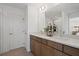 Modern bathroom featuring double vanities and a stylish glass-enclosed shower at 2054 Education St, St Cloud, FL 34771