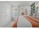 Bright bedroom with natural light, decorative wall hangings, and comfortable bedding creates a relaxing atmosphere at 2054 Education St, St Cloud, FL 34771