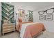 Stylish bedroom featuring built-in bookshelves, complementing the earthy tones of the decor at 2054 Education St, St Cloud, FL 34771