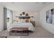 Cozy bedroom with modern accents and a tranquil view from the window at 2054 Education St, St Cloud, FL 34771