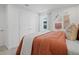 Cozy bedroom with natural light, decorative wall hangings, and comfortable bedding creates a relaxing atmosphere at 2054 Education St, St Cloud, FL 34771