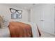Modern bedroom with plush bedding and unique decor adds a touch of personality to this comfortable space at 2054 Education St, St Cloud, FL 34771