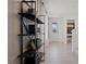 Hallway with a view of the powder room and entryway at 2054 Education St, St Cloud, FL 34771