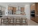 Modern kitchen with stainless steel appliances, a large island with seating, and plenty of cabinet space at 2054 Education St, St Cloud, FL 34771
