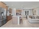 Bright kitchen features stainless steel appliances, a central island, and seamless flow to the living area at 2054 Education St, St Cloud, FL 34771