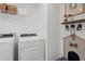 Laundry room features front load washer and dryer and accessories for pet decor at 2054 Education St, St Cloud, FL 34771