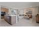 Open-concept living room featuring stylish furnishings and a seamless flow to the kitchen and dining area at 2054 Education St, St Cloud, FL 34771