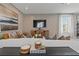 Neutral living room featuring a large painting and comfortable seating, creating a serene atmosphere at 2054 Education St, St Cloud, FL 34771