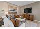 Inviting living room featuring art, stylish seating, and a sleek area rug at 2054 Education St, St Cloud, FL 34771
