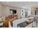 Comfortable living room with neutral tones, modern furniture, and a large television at 2054 Education St, St Cloud, FL 34771