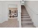 Clean and modern staircase leading to an open living space with stylish decor at 2054 Education St, St Cloud, FL 34771