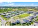 Aerial view of a well-planned residential community with green spaces and landscaping at 2223 Blue Salvia St, Clermont, FL 34711