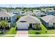 Overhead view of well-manicured property showcasing the roof, lawn, and surrounding neighborhood at 2223 Blue Salvia St, Clermont, FL 34711